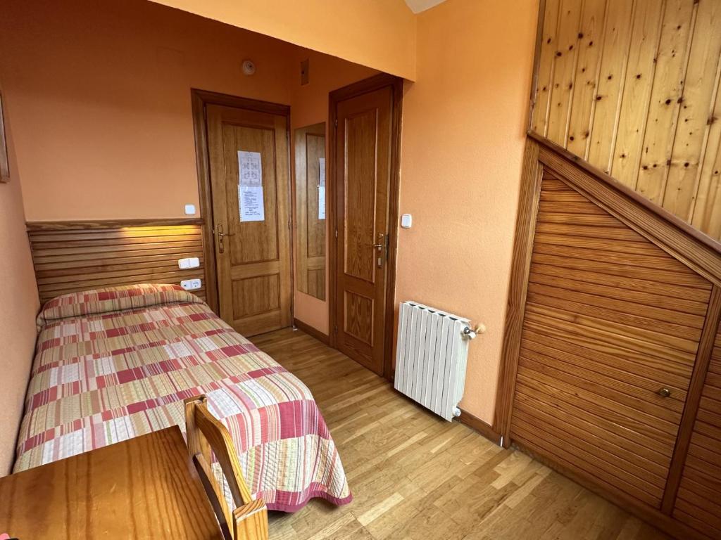 Postel nebo postele na pokoji v ubytování Hosteria Gelin de Gajano