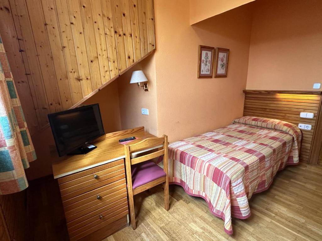 TV a/nebo společenská místnost v ubytování Hosteria Gelin de Gajano