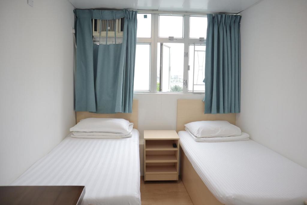 Voodi või voodid majutusasutuse Hoi To Hostel toas