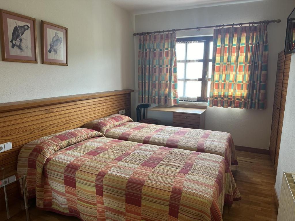 Postel nebo postele na pokoji v ubytování Hosteria Gelin de Gajano