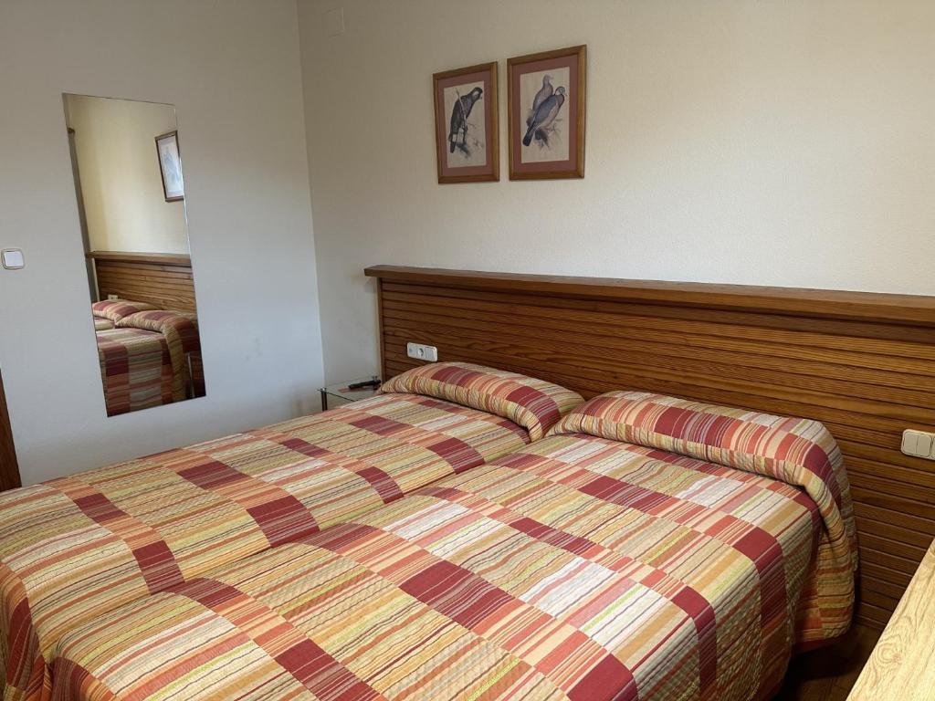Postel nebo postele na pokoji v ubytování Hosteria Gelin de Gajano