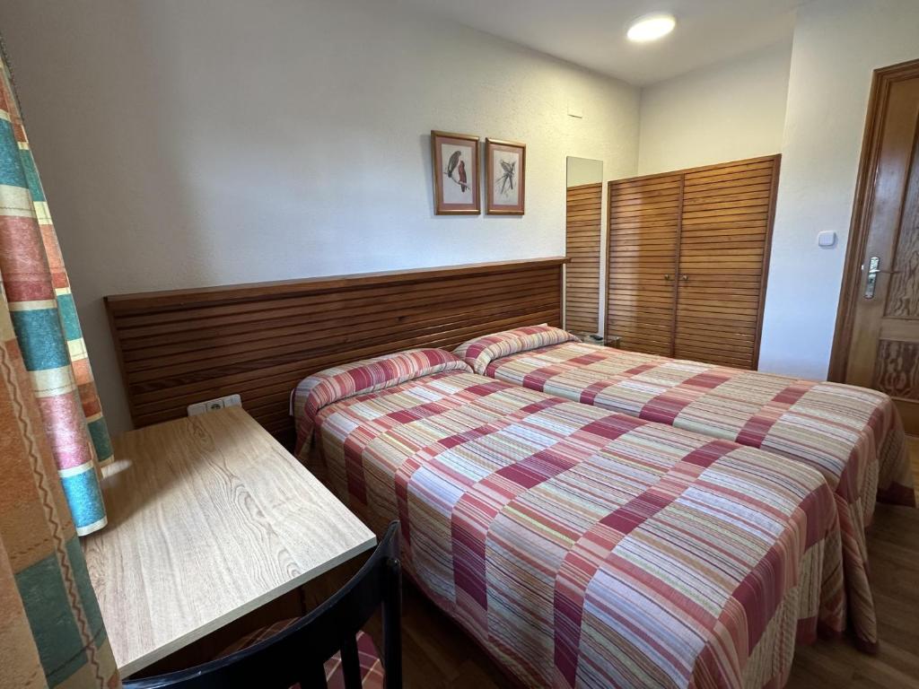 Postel nebo postele na pokoji v ubytování Hosteria Gelin de Gajano