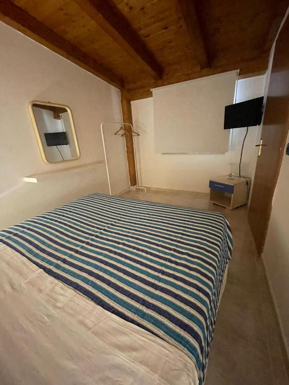 Postel nebo postele na pokoji v ubytování -DIMARTINO HOME- Posizione centrale 9 min da Marzamemi San Lorenzo Portopalo di Capo Passero