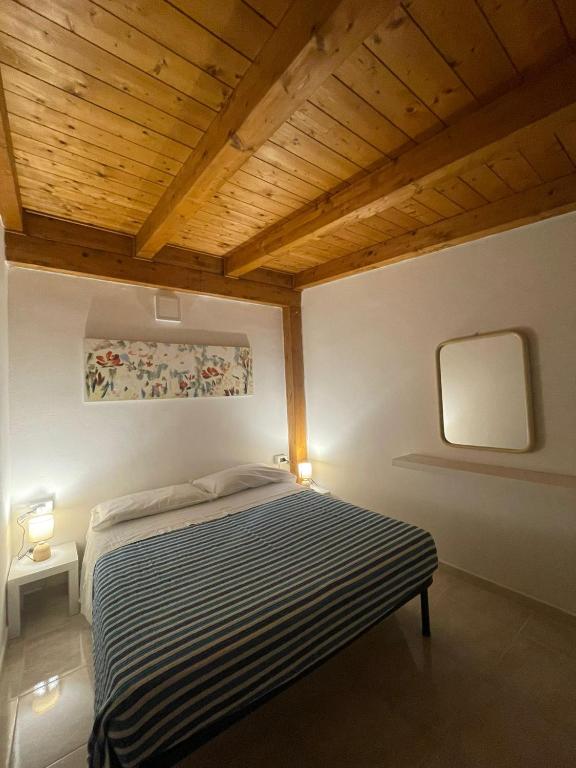 Postel nebo postele na pokoji v ubytování -DIMARTINO HOME- Posizione centrale 9 min da Marzamemi San Lorenzo Portopalo di Capo Passero