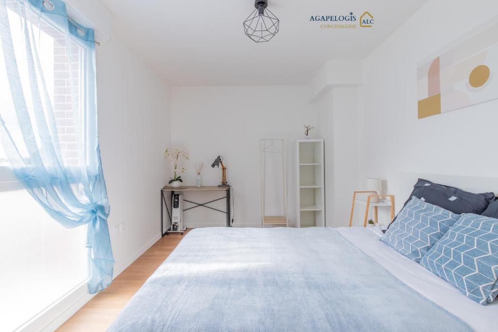 Ένα ή περισσότερα κρεβάτια σε δωμάτιο στο Bel Appartement gare Wifi