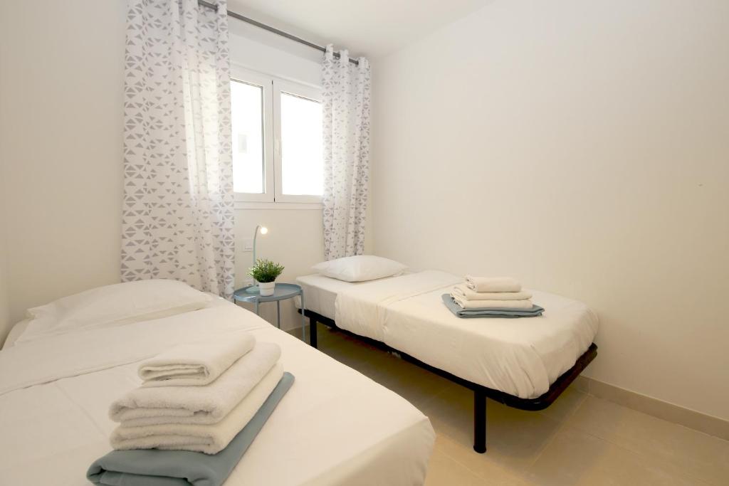 Łóżko lub łóżka w pokoju w obiekcie Apartment BEATRIX