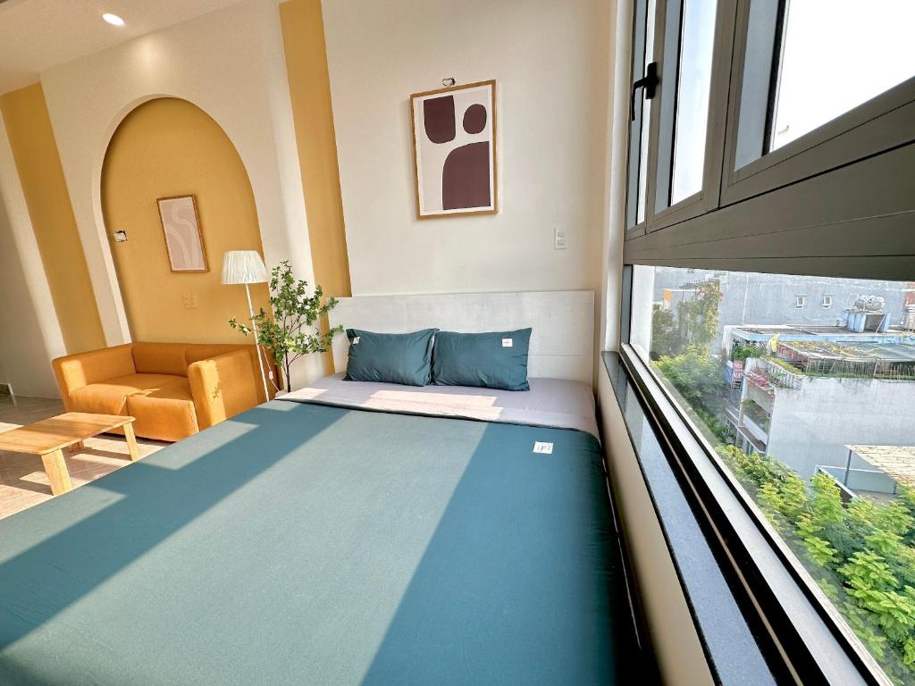 Postel nebo postele na pokoji v ubytování Corgi House Danang
