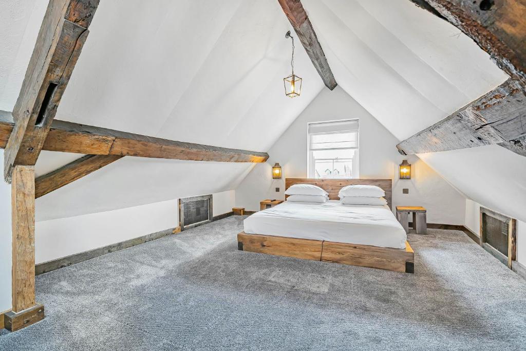 a bedroom with a bed in a attic at Chester Rose on the Chester Rows in Chester