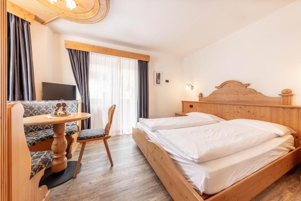 Postel nebo postele na pokoji v ubytování Hotel Siror