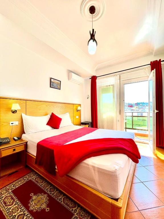 Postel nebo postele na pokoji v ubytování Sary's Hotel