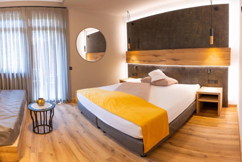Postel nebo postele na pokoji v ubytování Hotel Garni Christin