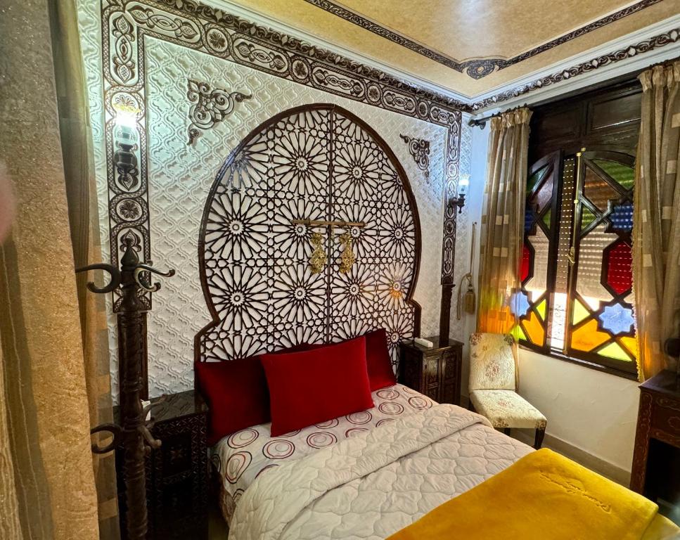 Postel nebo postele na pokoji v ubytování Riad Mogador