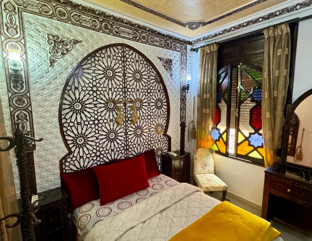 Postel nebo postele na pokoji v ubytování Riad Mogador