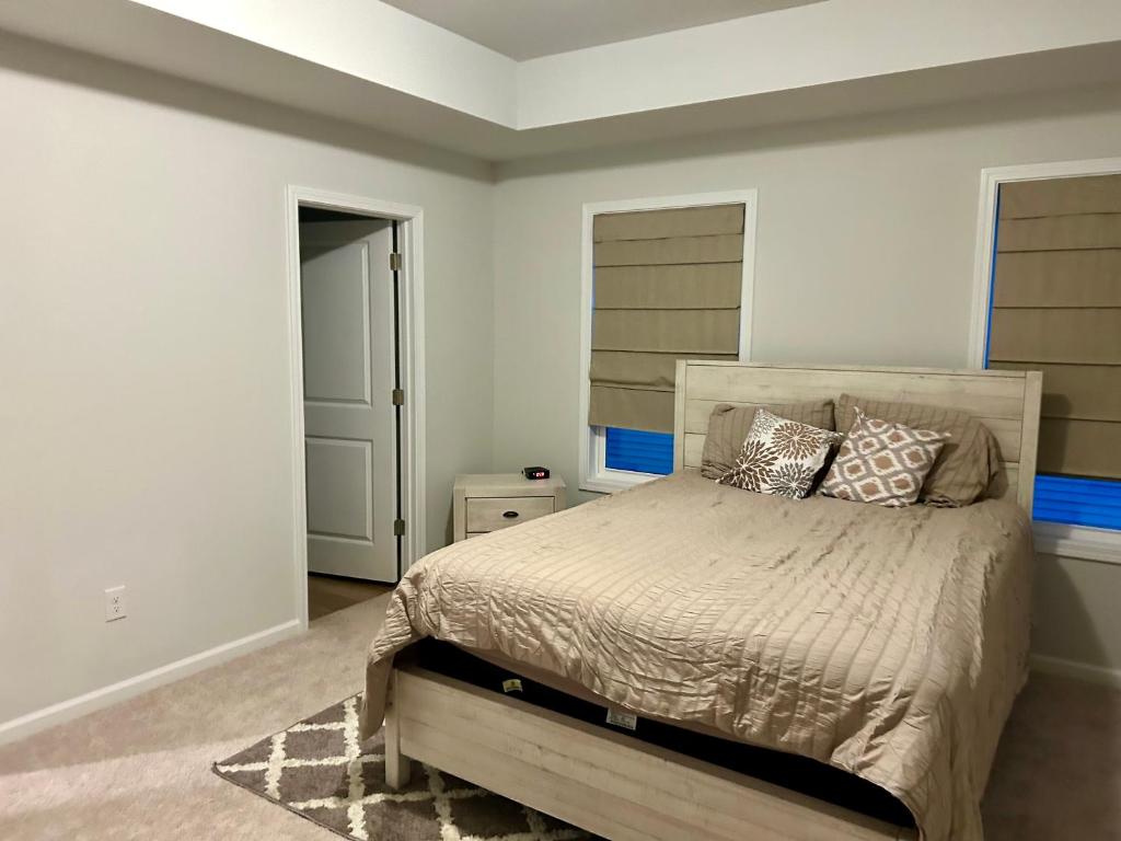 a bedroom with a bed with pillows on it at Nurse's Nest LLC in Spartanburg