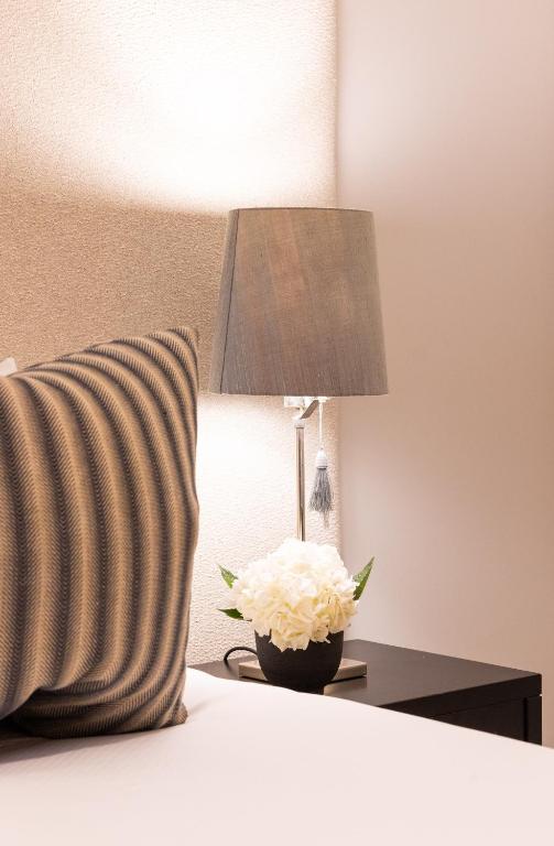 Postel nebo postele na pokoji v ubytování Boutique Hotel Stari Grad
