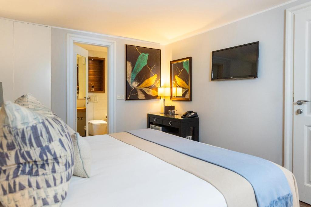 Postel nebo postele na pokoji v ubytování Boutique Hotel Stari Grad