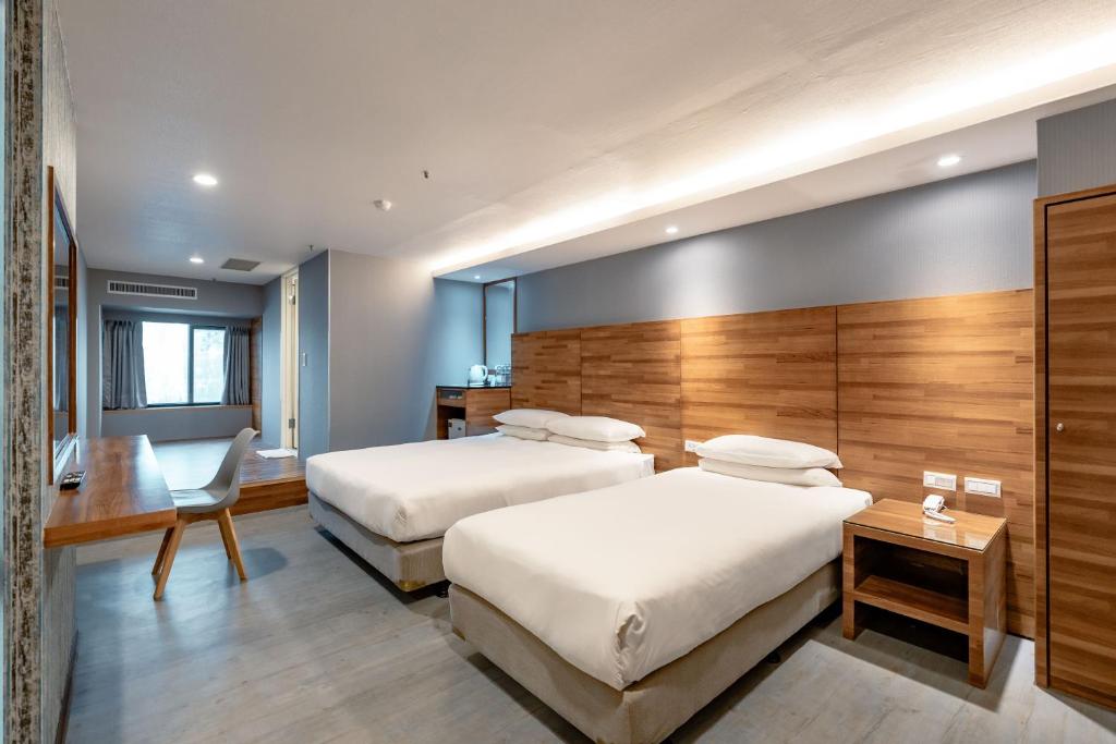 Postel nebo postele na pokoji v ubytování 雲沐行旅 Hotel Cloud Arena-Daan