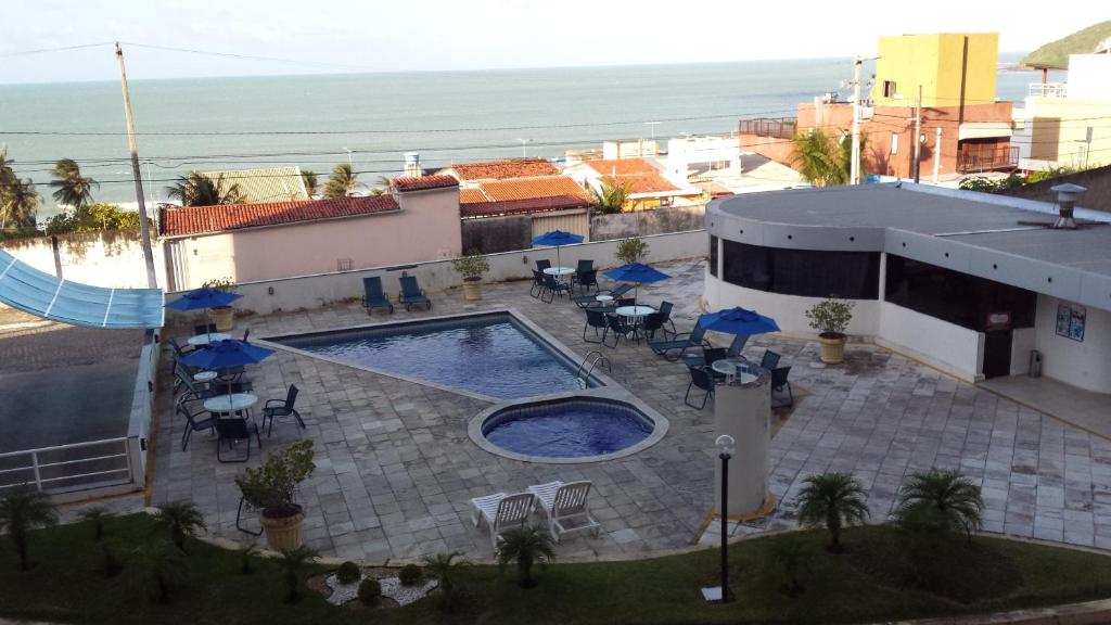 Vista de la piscina de Flat Particular em Ponta Negra o alrededores