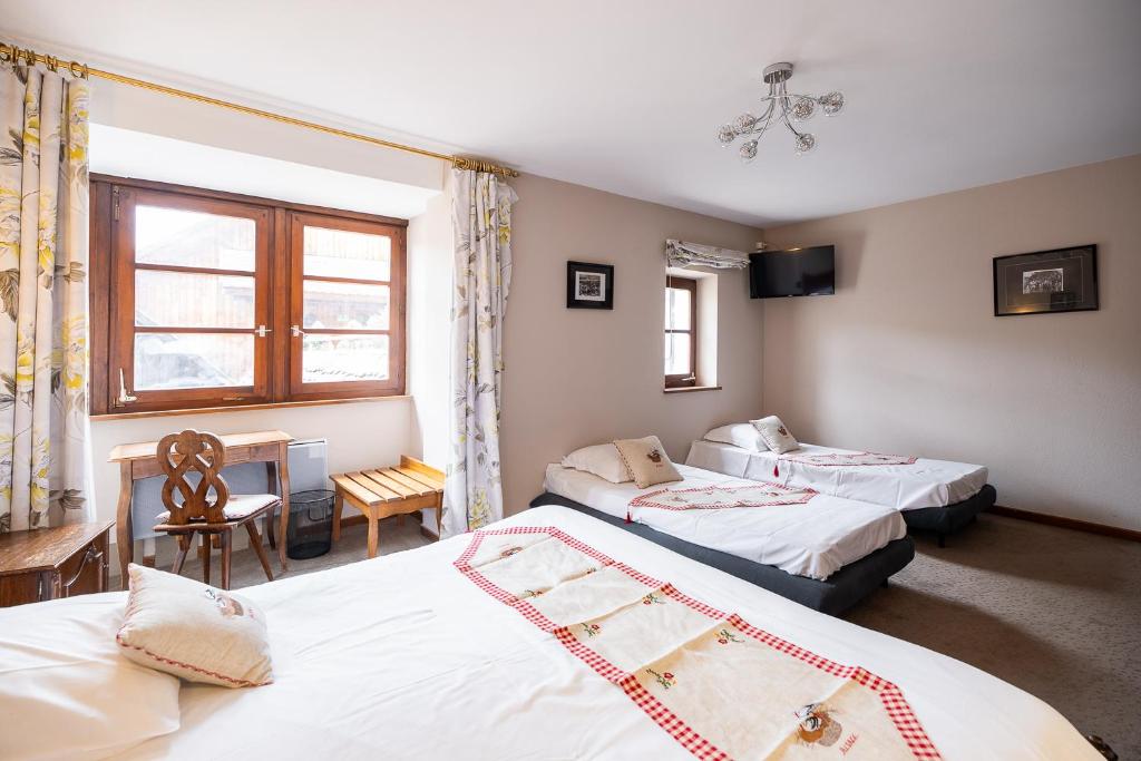 Postel nebo postele na pokoji v ubytování Hôtel Berceau Du Vigneron
