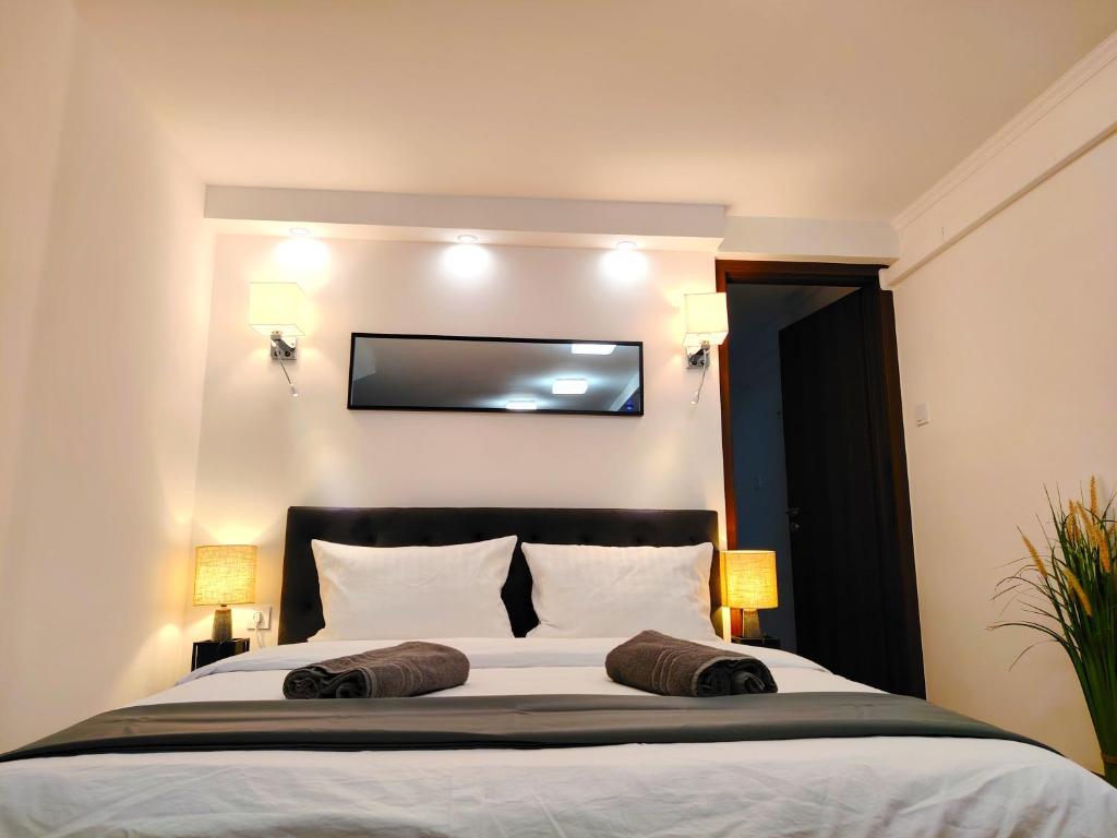 Postel nebo postele na pokoji v ubytování Nyuszis Apartman