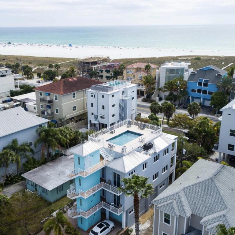an aerial view of a building and the beach at A Somewhere is Here by Beachside Management in Siesta Key