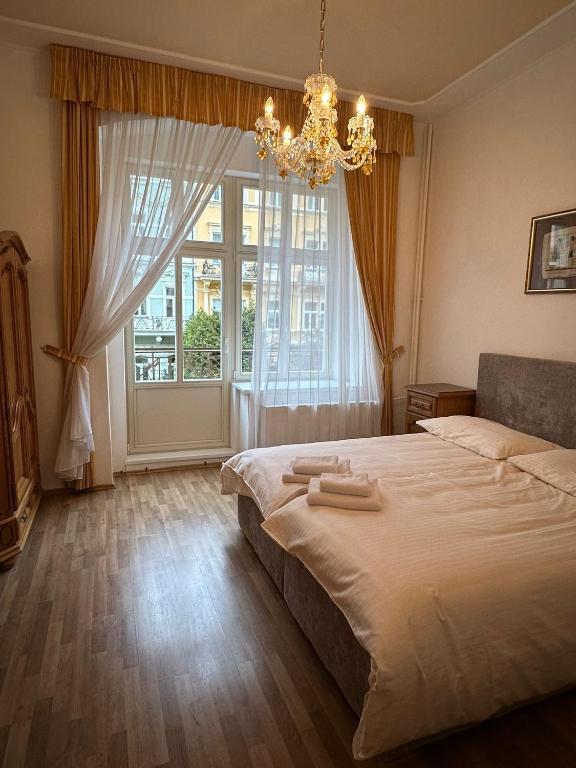 Postel nebo postele na pokoji v ubytování Hotel Praga