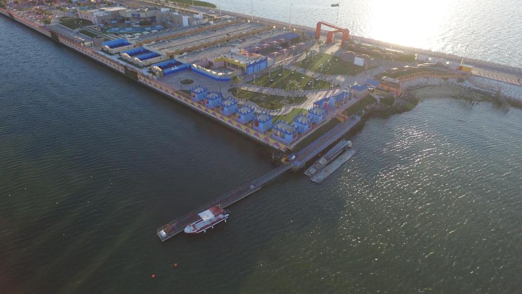 an aerial view of a dock in the water at منتجع درة الشرق للعائلات in Dammam