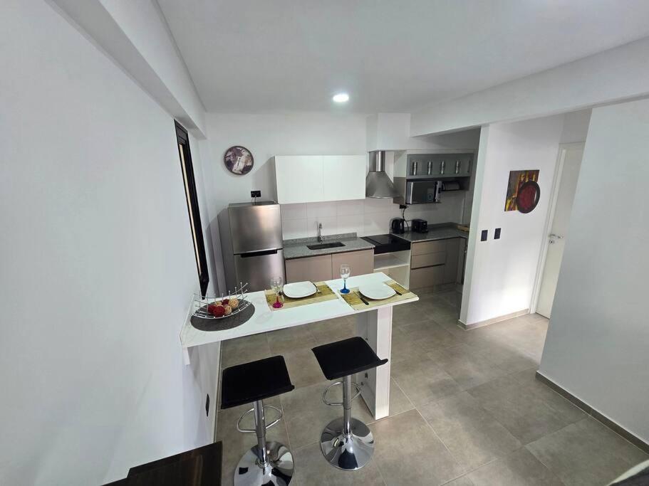 a kitchen with a white counter top in a room at Departamento a estrenar in Godoy Cruz