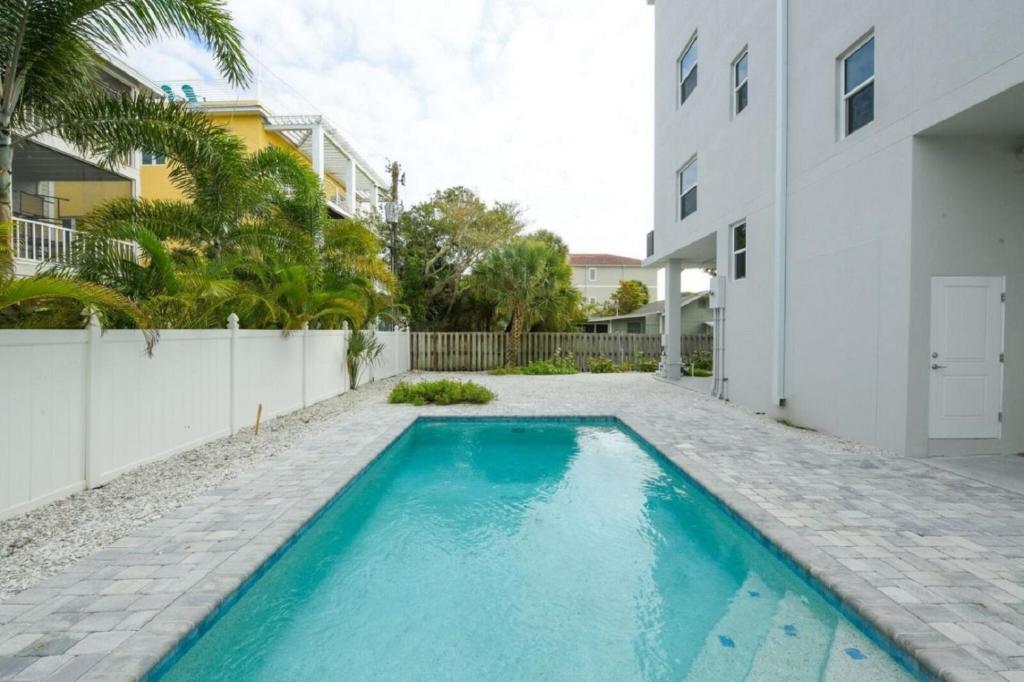 a swimming pool in the backyard of a house at Family Tides in Siesta Key