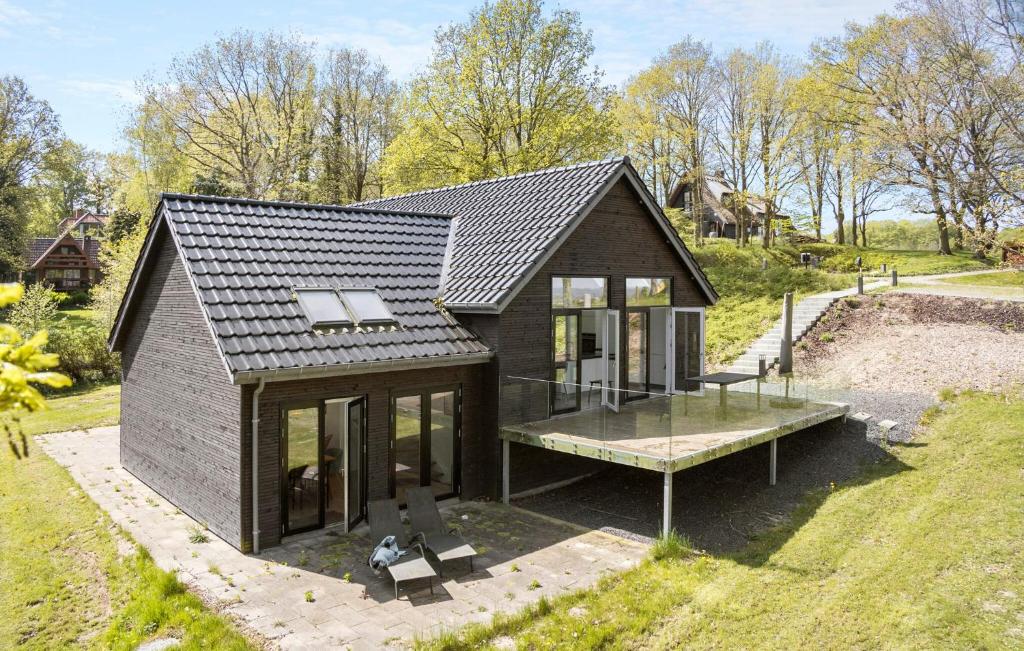 a small black house with a glass floor at Cozy Home In Asperup With Kitchen in Asperup