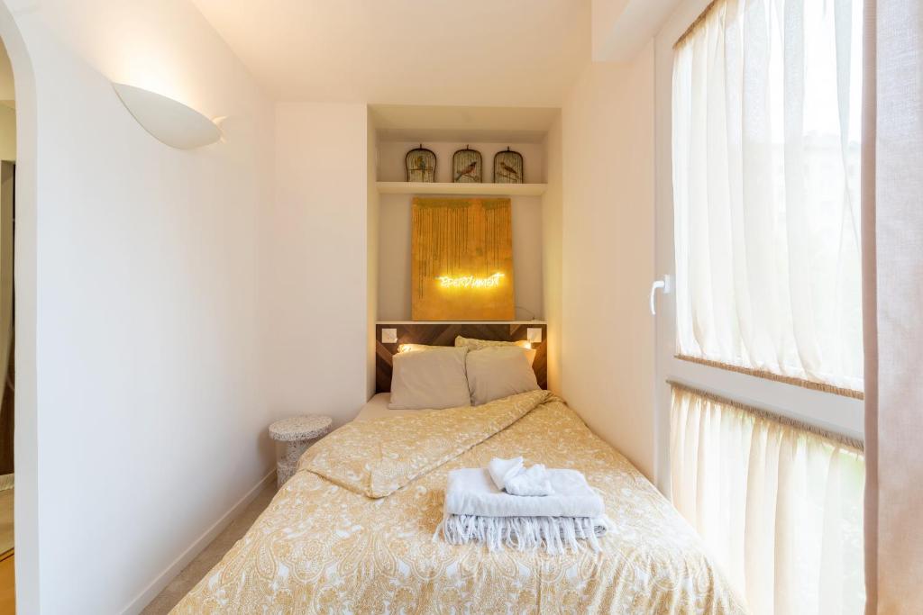 מיטה או מיטות בחדר ב-Le Cosy Du Palais