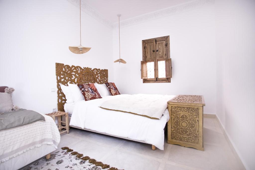 Postel nebo postele na pokoji v ubytování Riad Bab Aljana