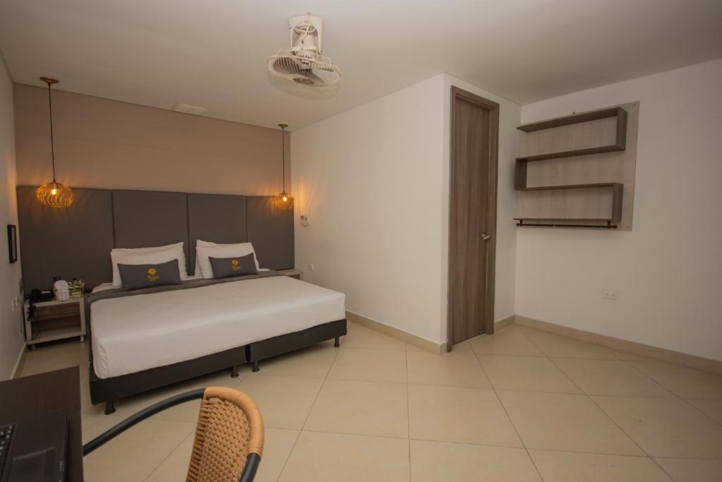 Postel nebo postele na pokoji v ubytování Hotel Perlatto
