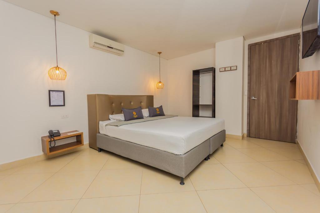 Postel nebo postele na pokoji v ubytování Hotel Perlatto