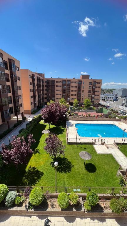 an aerial view of a park with a swimming pool at Ole Madrid Holiday Apartament IFEMA, Aeropuerto in Madrid