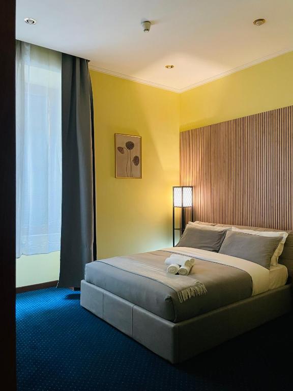 Postel nebo postele na pokoji v ubytování Hotel Rome place
