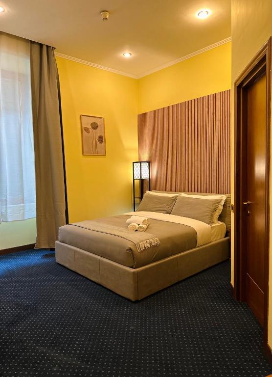 Postel nebo postele na pokoji v ubytování Hotel Rome place