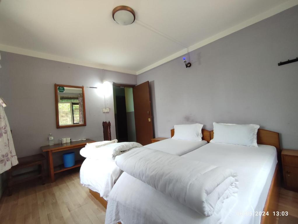 Postel nebo postele na pokoji v ubytování Hotel Mount Paradise