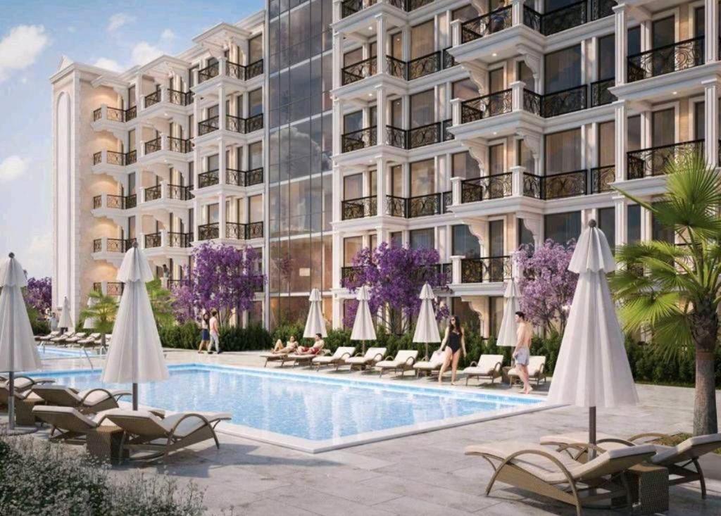 eine künstlerische Darstellung eines geplanten Apartmentgebäudes mit einem Pool in der Unterkunft Premium Ferienwohnung SWETI WLAS Polarstar Beach Luxury Apartment 150 m zum Strand Pool 3 Balkone Meeresblick Google TV bis zu 6 Personen in Sweti Wlas