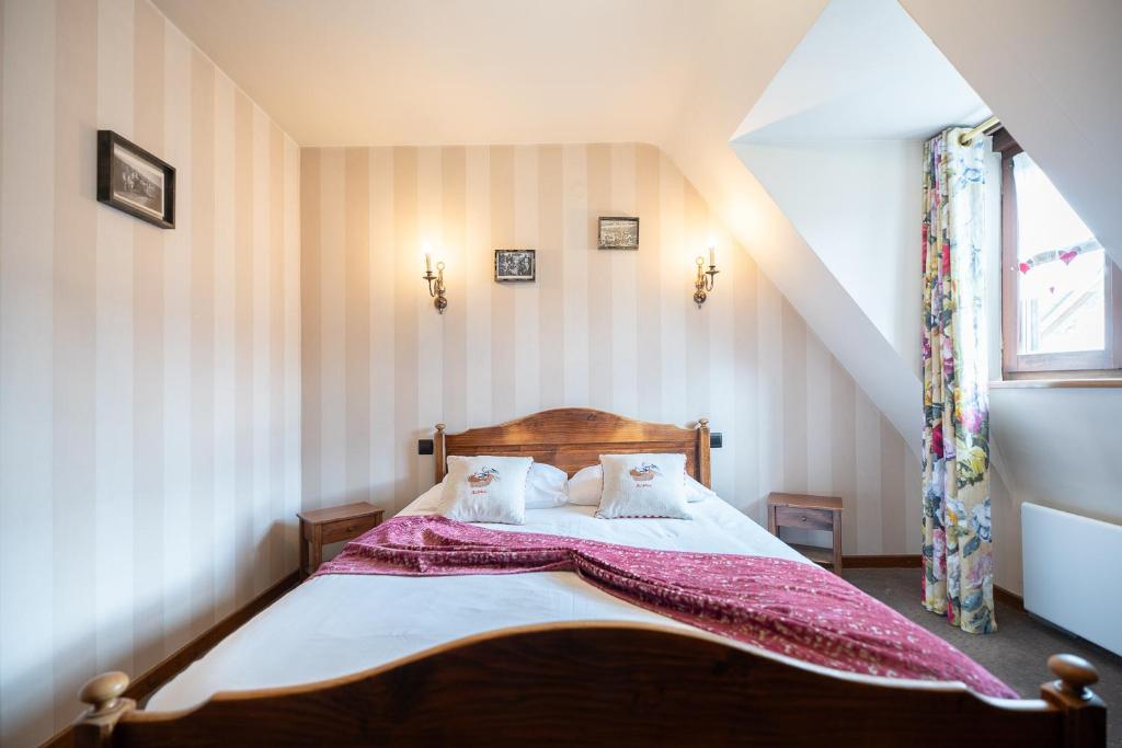 Postel nebo postele na pokoji v ubytování Hôtel Berceau Du Vigneron