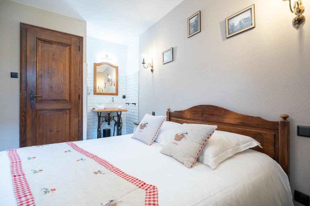 Postel nebo postele na pokoji v ubytování Hôtel Berceau Du Vigneron