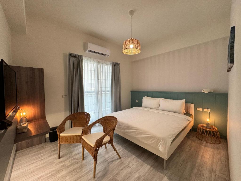 Postel nebo postele na pokoji v ubytování WinXin House