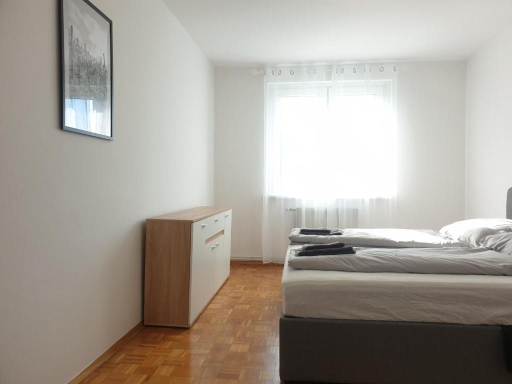 Letto o letti in una camera di Somnium - Appartements Südsteiermark - Ehrenhausen