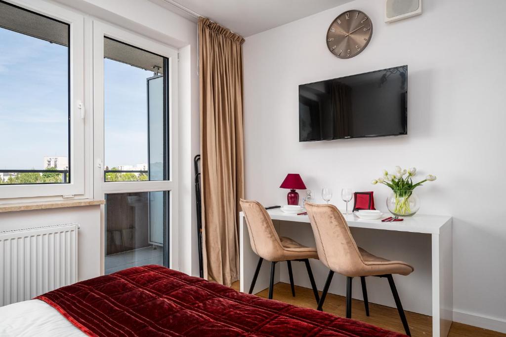 TV a/nebo společenská místnost v ubytování Pileckiego Residence