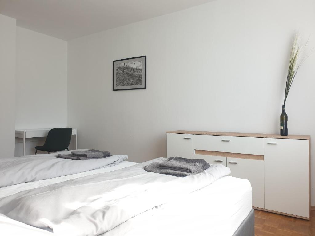 Letto o letti in una camera di Somnium - Appartements Südsteiermark - Ehrenhausen