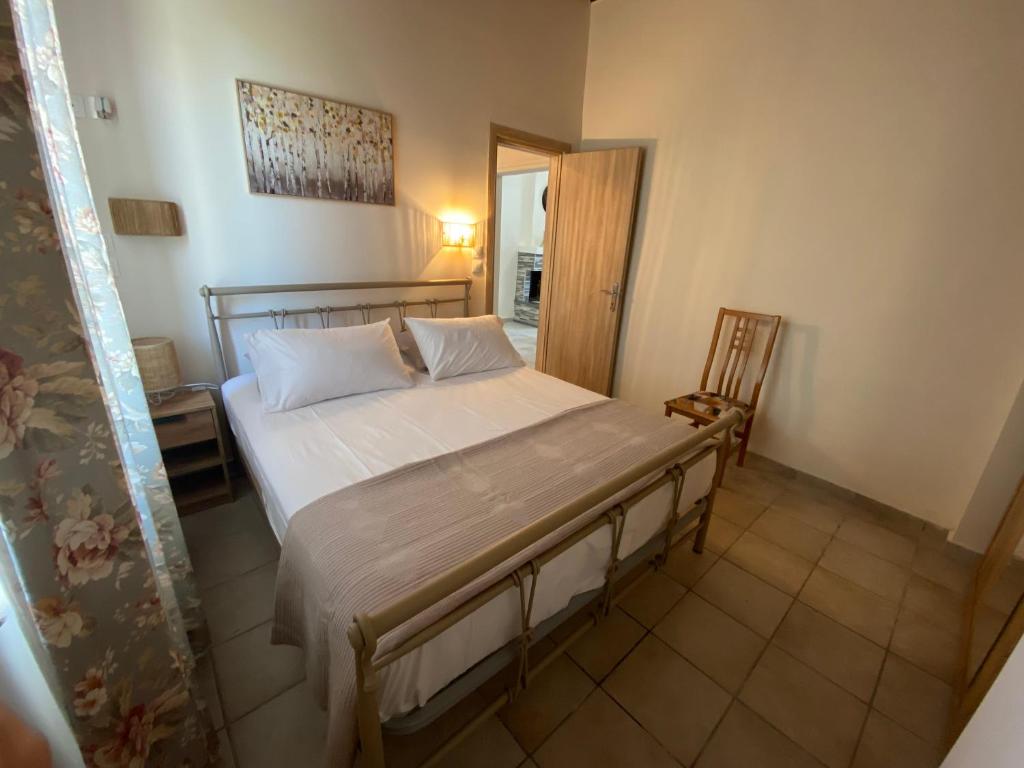 Кровать или кровати в номере Aphrodite Apartments