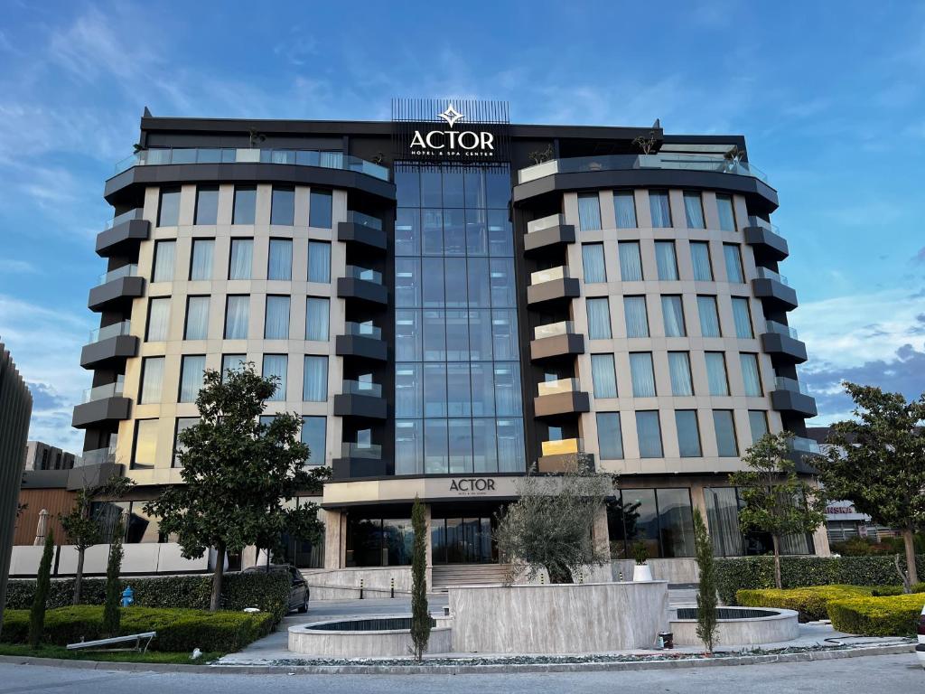 a building with a sign on the front of it at Actor Hotel in Skopje
