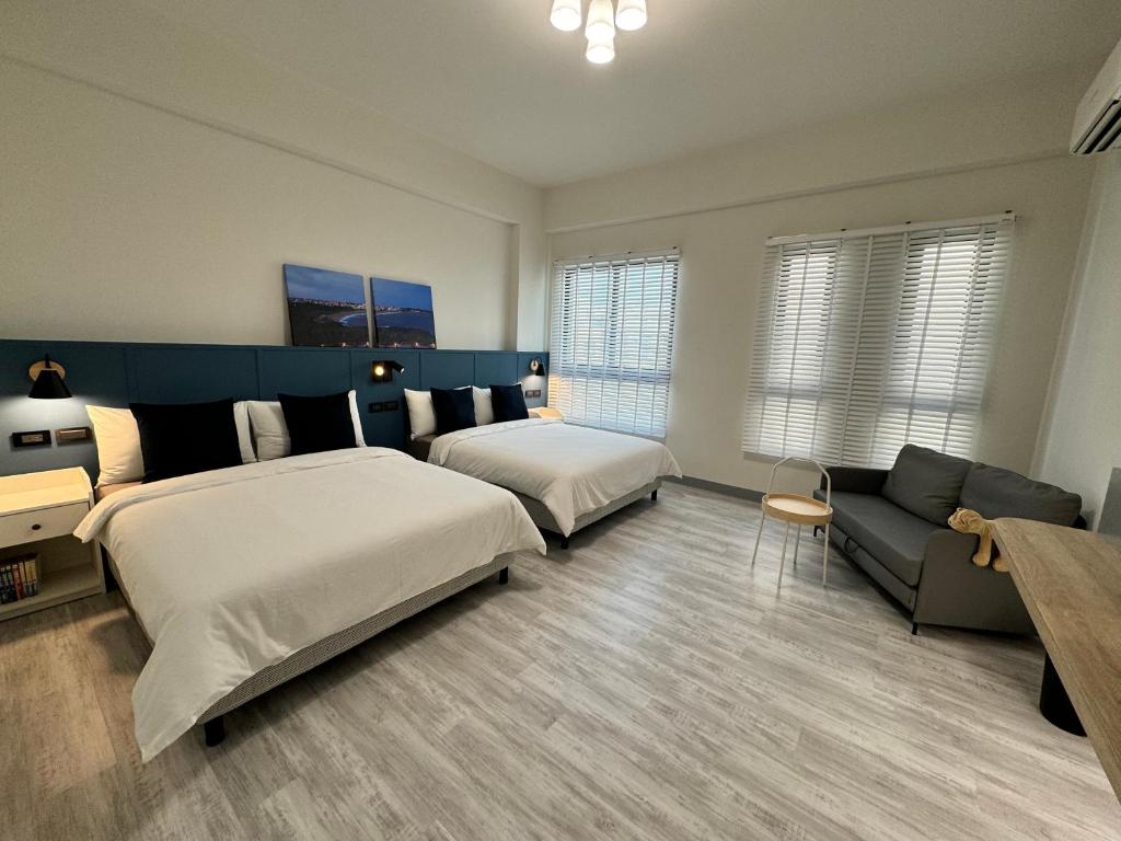 Postel nebo postele na pokoji v ubytování WinXin House