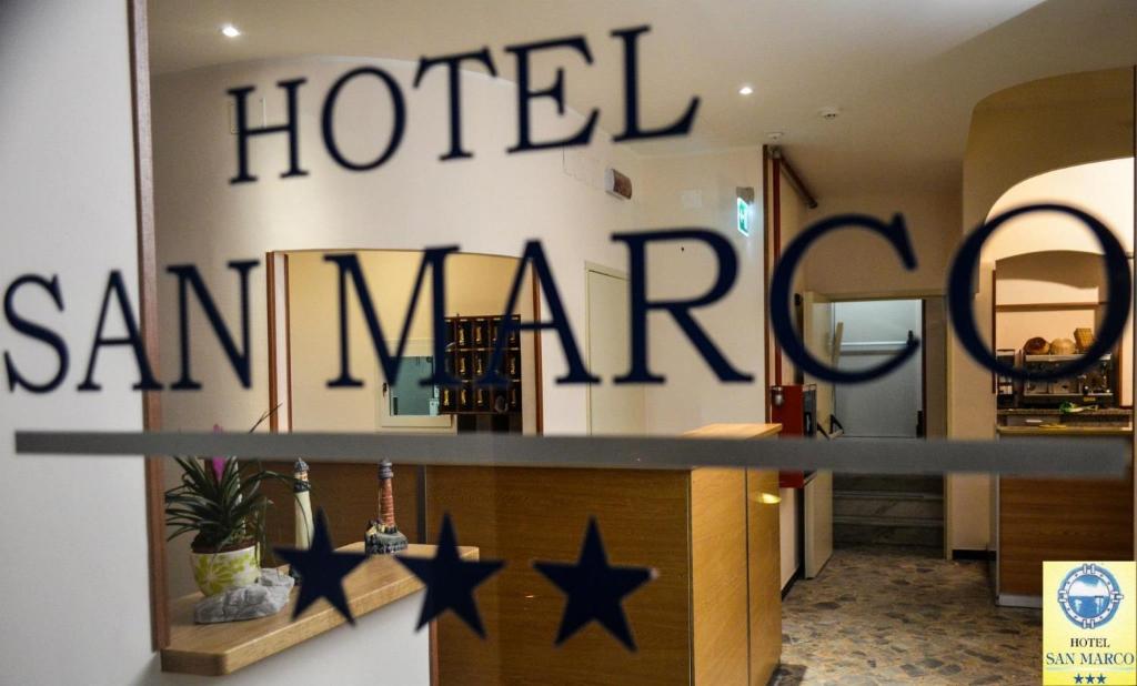 a hotel san francisco sign on a wall with stars at Hotel San Marco in Savona