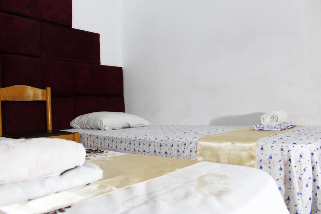 Postel nebo postele na pokoji v ubytování Hotel Erisun